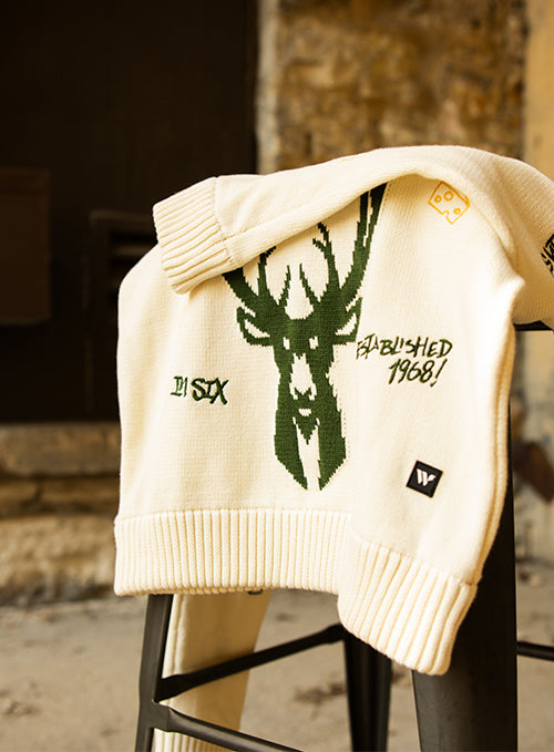 Bucks In Six x The Wild Collective All Over Print Jacquard Milwaukee Bucks Crewneck Sweatshirt-on stool
