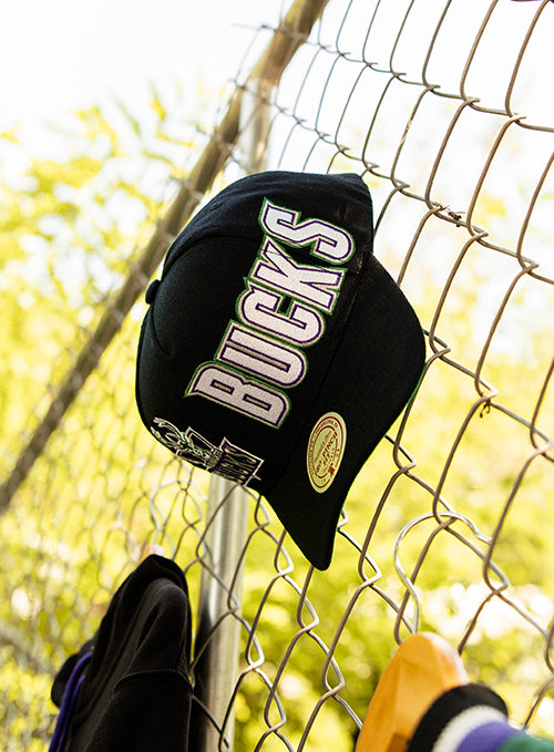 Mitchell & Ness HWC '93 Playmaker Milwaukee Bucks Adjustable Hat-on fence
