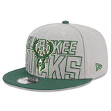New Era Draft 2023 9Fifty Grey Milwaukee Bucks Snapback Hat in Grey and Green - Angled Left Side View