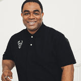 Magna-Ready Adaptive Black Pique Knit Milwaukee Bucks Short Sleeve Polo with Magnetic Closures- model
