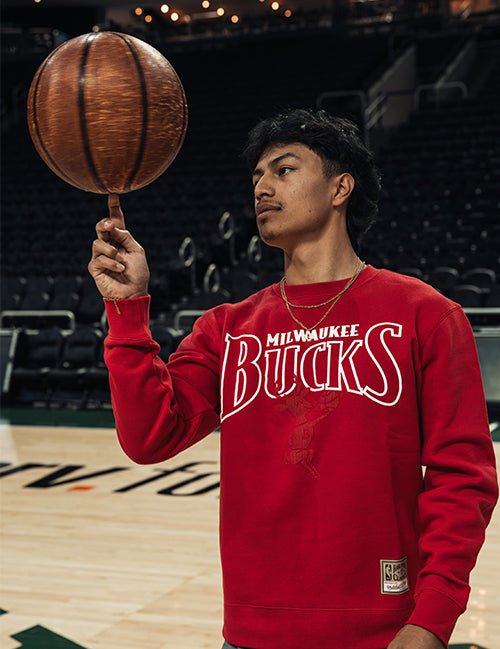 Mitchell & Ness HWC '68 Rebound Legacy Milwaukee Bucks Crewneck Sweatshirt-on model