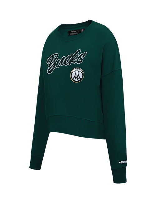 A dark green cropped crewneck sweatshirt featuring 'Bucks' in white script with a black outline and the Milwaukee Bucks logo on the front, shown on a plain white background.