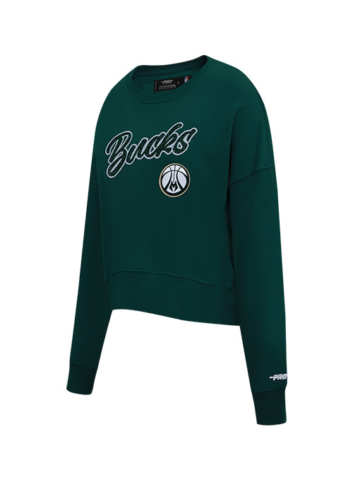 A dark green cropped crewneck sweatshirt featuring 'Bucks' in white script with a black outline and the Milwaukee Bucks logo on the front, shown on a plain white background.