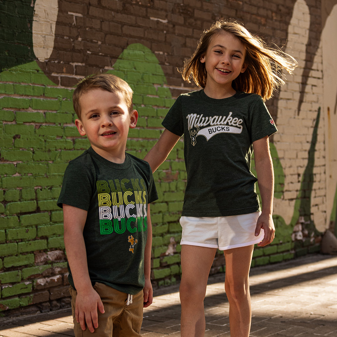 boy and girl in Milwaukee Bucks merchandise 