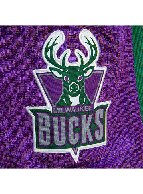 Mitchell & Ness Hardwood Classics 1993 75th Anniversary Milwaukee Bucks Swingman Shorts In White, Purple And Green - Zoom View On Leg Logo Graphic