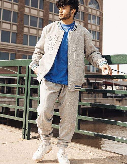 The Wild Collective Established Logo Milwaukee Bucks Jogger In Grey - Front View On Model