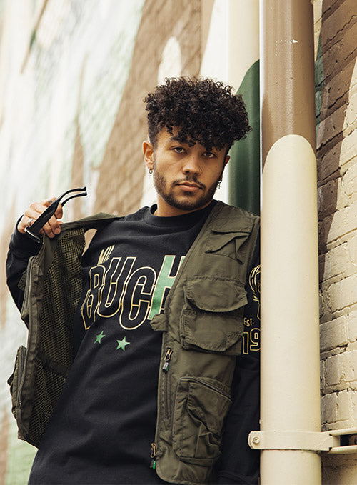 The Wild Collective Deer District Milwaukee Bucks Long Sleeve T-Shirt In Black - Front View On Model