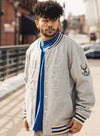 The Wild Collective Embossed Milwaukee Bucks Bomber Jacket In Grey - Front View On Model