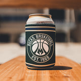 Logo Brand Establish Stripes Milwaukee Bucks Can Koozie In Green - Lifestyle Shot Of Koozie Standing On Bench With Can Inside