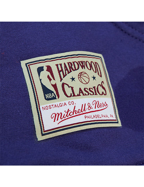 Mitchell & Ness HWC'93 Game Day Pattern Milwaukee Bucks Hooded Sweatshirt In Purple - Zoom View On Left Hip Tag
